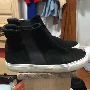 Black ankle boot with white rubber sole